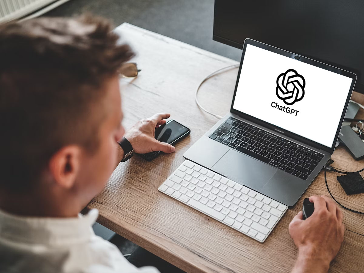 man on laptop using chat GPT