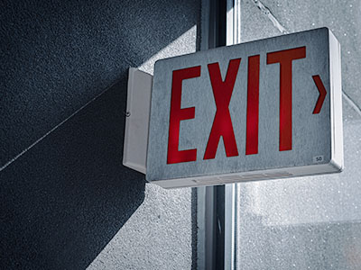 Incandescent exit sign on the wall