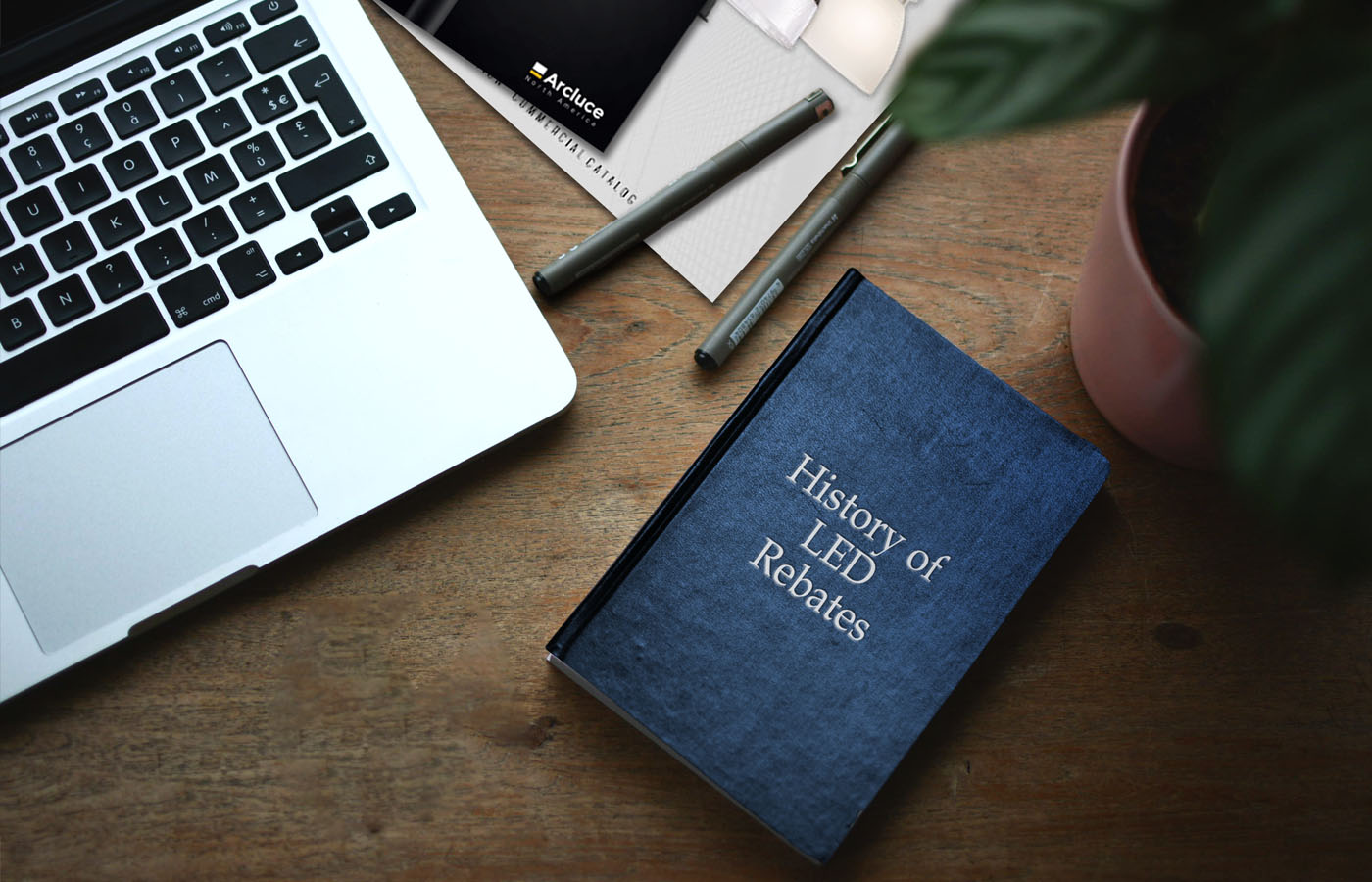 History of LED Rebates book on table